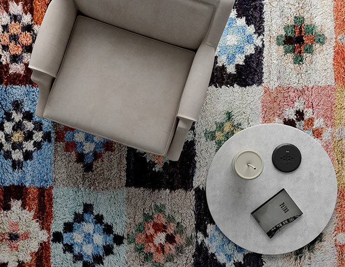 cream rug on grey carpet