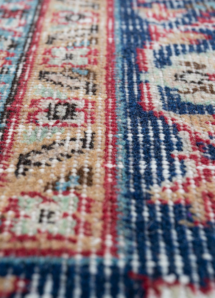 vintage red and orange wool hand knotted Rug - CloseUp