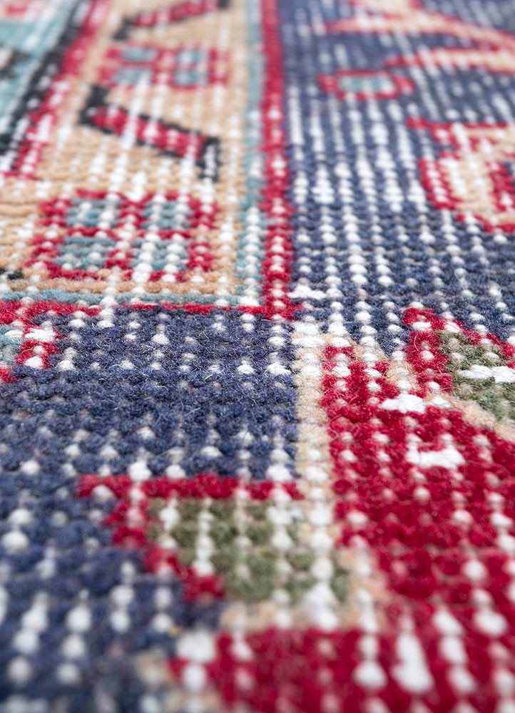 vintage red and orange wool hand knotted Rug - CloseUp vintage red and orange wool hand knotted Rug - CloseUp