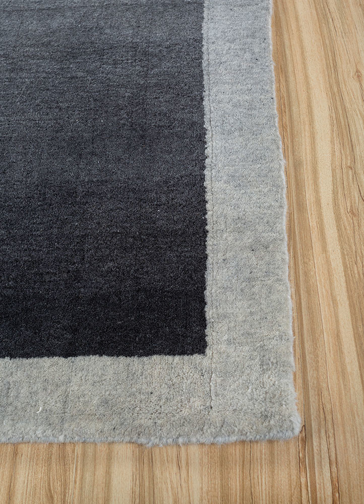 jean grey and black wool hand loom Rug - Corner
