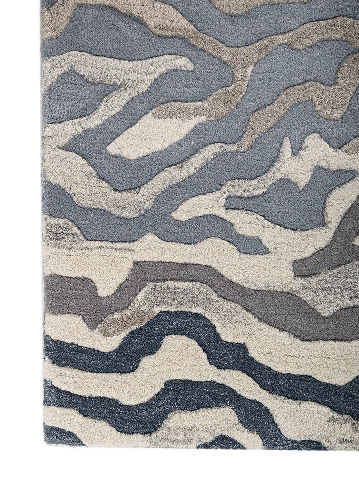 linear blue wool and viscose hand tufted Rug - Corner