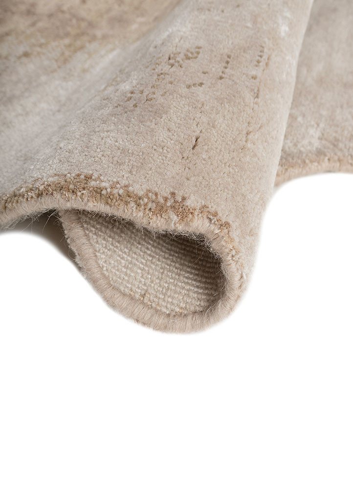 aprezo ivory wool and bamboo silk hand knotted Rug - FoldShot aprezo ivory wool and bamboo silk hand knotted Rug - FoldShot