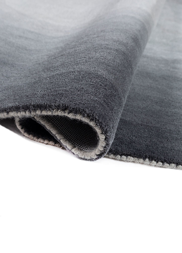 chroma grey and black wool hand tufted Rug - FoldShot
