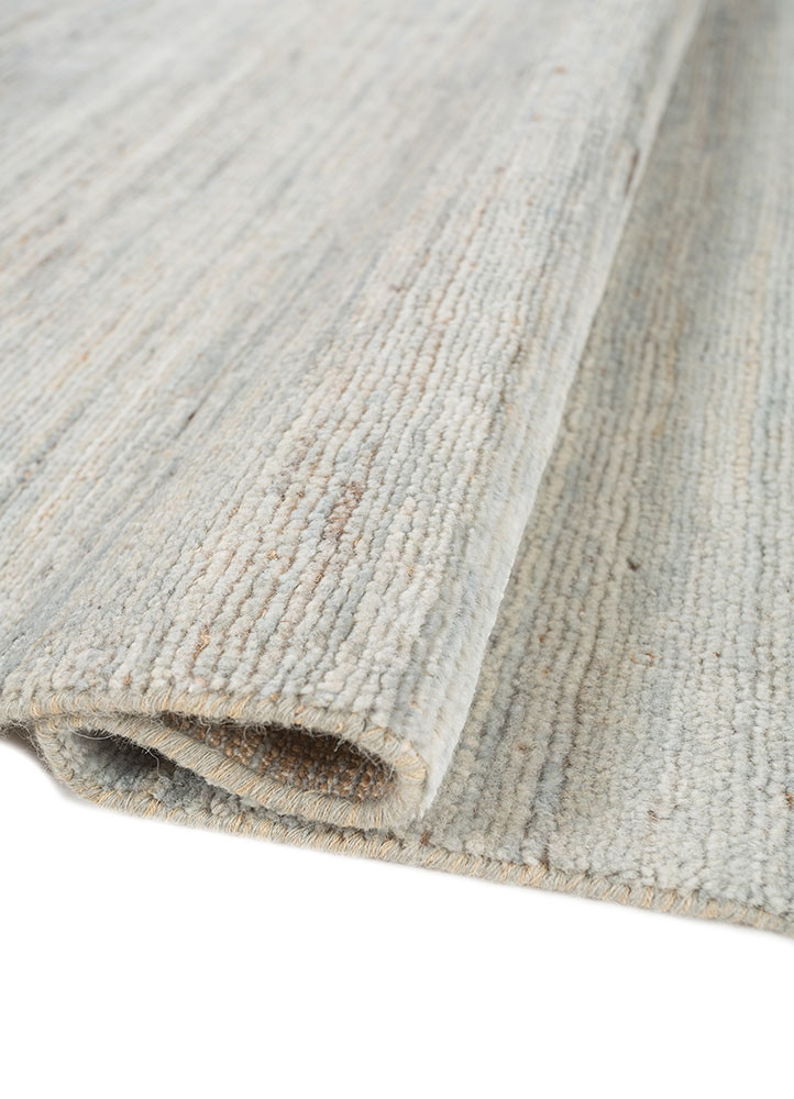 manifest blue afghan wool and jute hand knotted Rug - FoldShot manifest blue afghan wool and jute hand knotted Rug - FoldShot