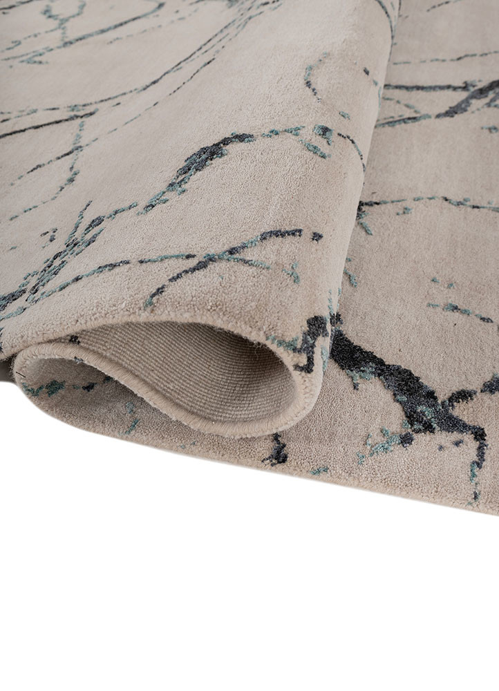 urban pause by kavi ivory wool and silk hand knotted Rug - FoldShot