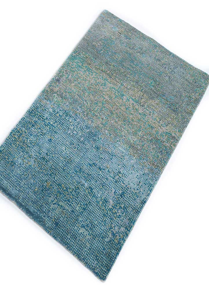afterglow by kavi blue wool and bamboo silk hand knotted Rug - FoldShot afterglow by kavi blue wool and bamboo silk hand knotted Rug - FoldShot