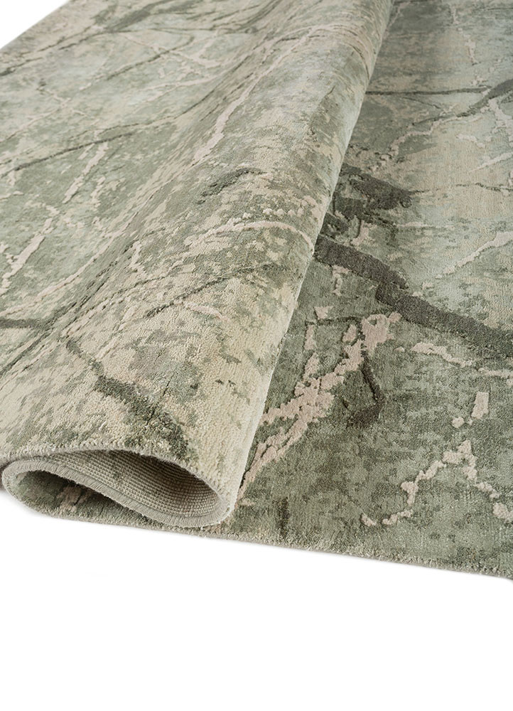 urban pause by kavi green wool and bamboo silk hand knotted Rug - FoldShot urban pause by kavi green wool and bamboo silk hand knotted Rug - FoldShot