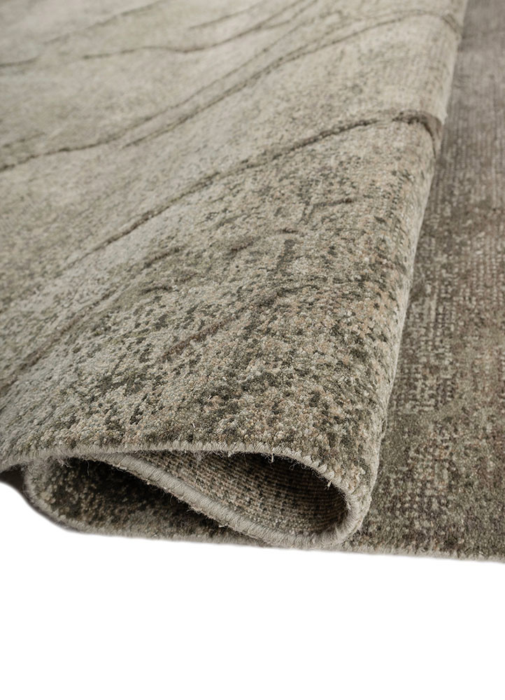 urban pause by kavi green wool and bamboo silk hand knotted Rug - FoldShot urban pause by kavi green wool and bamboo silk hand knotted Rug - FoldShot