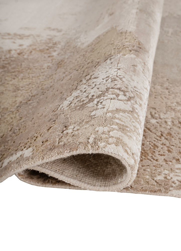 uvenuti ivory wool and bamboo silk hand knotted Rug - FoldShot uvenuti ivory wool and bamboo silk hand knotted Rug - FoldShot
