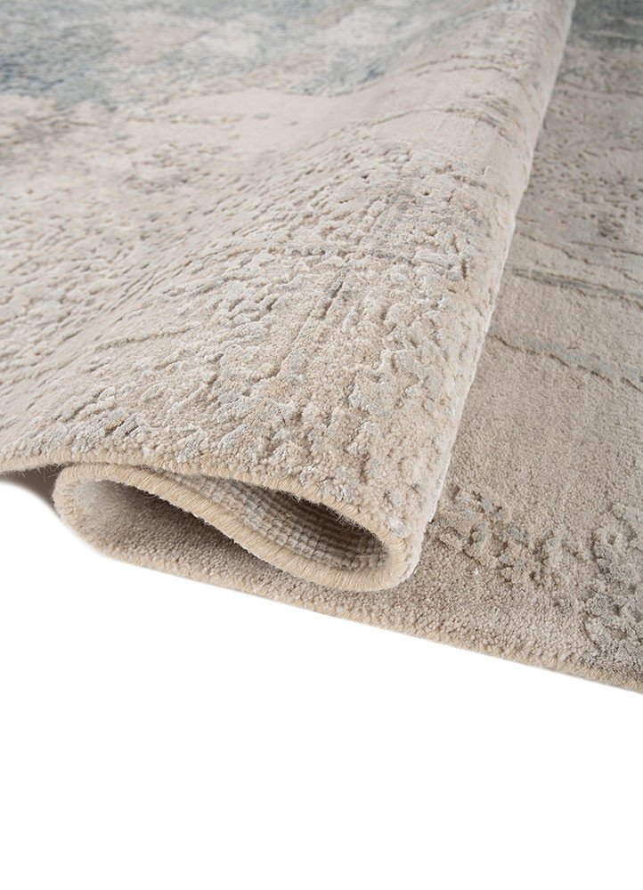 uvenuti ivory wool and bamboo silk hand knotted Rug - FoldShot uvenuti ivory wool and bamboo silk hand knotted Rug - FoldShot