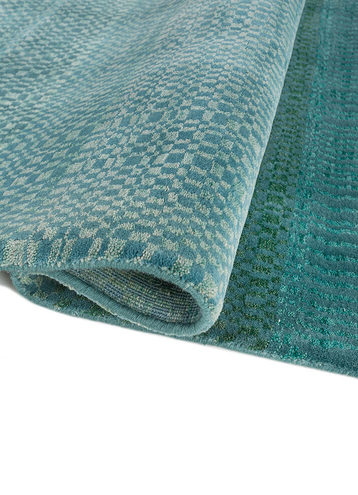 kavi x manchaha green wool hand knotted Rug - FoldShot kavi x manchaha green wool hand knotted Rug - FoldShot