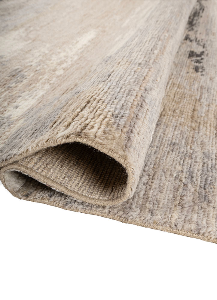 uvenuti ivory afghan wool hand knotted Rug - FoldShot uvenuti ivory afghan wool hand knotted Rug - FoldShot