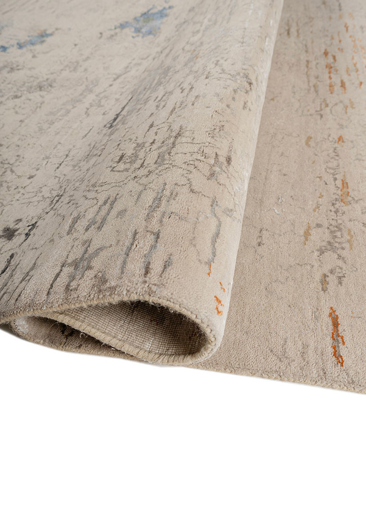 aprezo ivory wool and bamboo silk hand knotted Rug - FoldShot aprezo ivory wool and bamboo silk hand knotted Rug - FoldShot