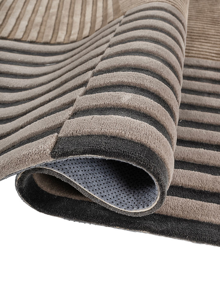 faces grey and black wool and viscose hand tufted Rug - FoldShot