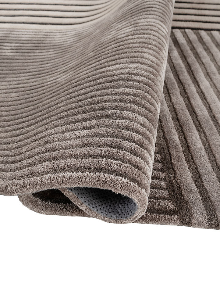 faces grey and black wool and viscose hand tufted Rug - FoldShot