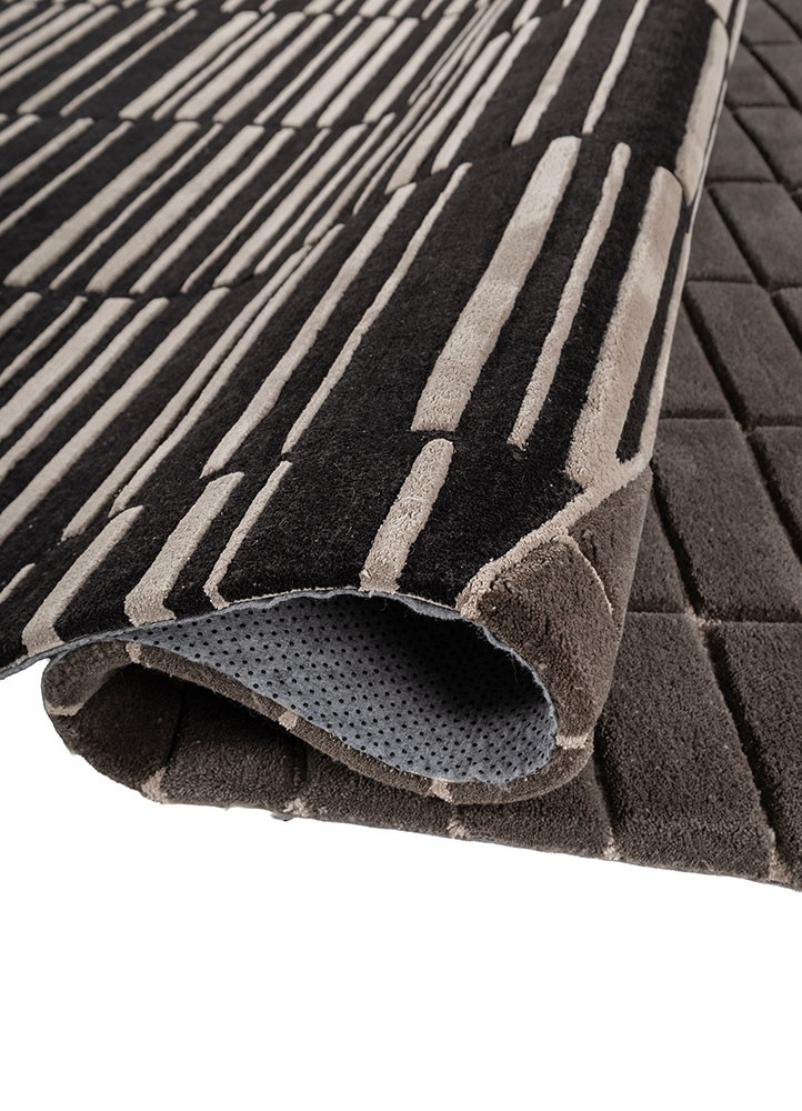 faces grey and black wool and viscose hand tufted Rug - FoldShot