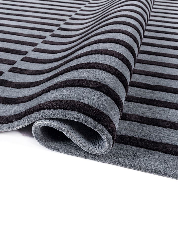 faces grey and black wool and viscose hand tufted Rug - FoldShot