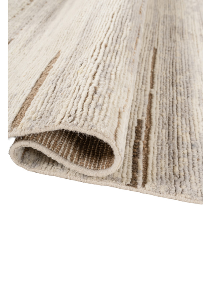 manifest ivory wool hand knotted Rug - FoldShot manifest ivory wool hand knotted Rug - FoldShot