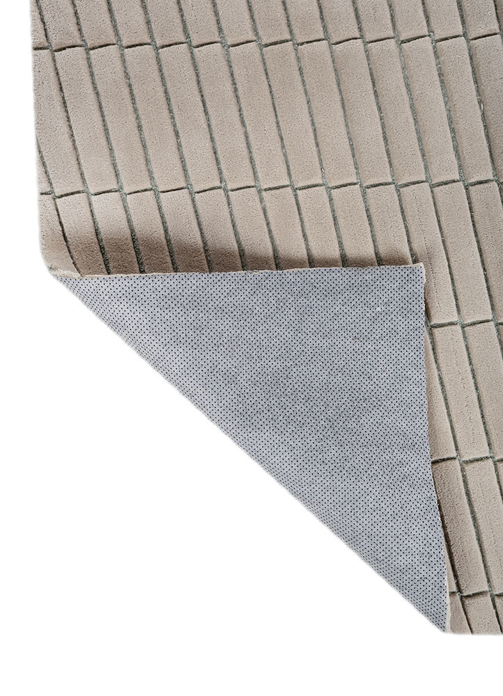 faces blue wool and viscose hand tufted Rug - Backing Shot