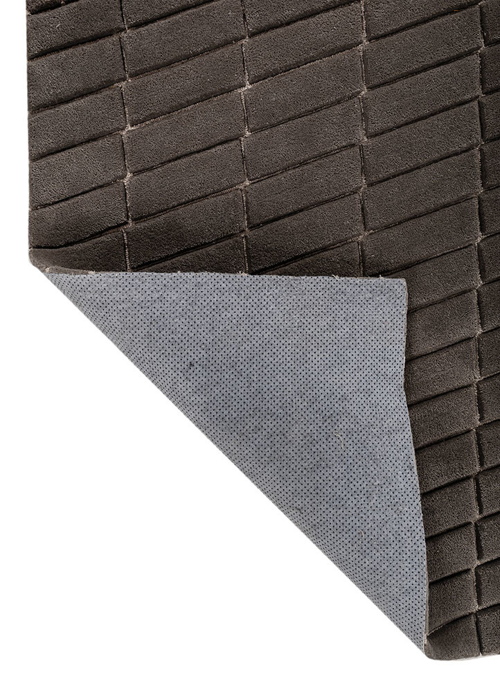 faces grey and black wool and viscose hand tufted Rug - Backing Shot