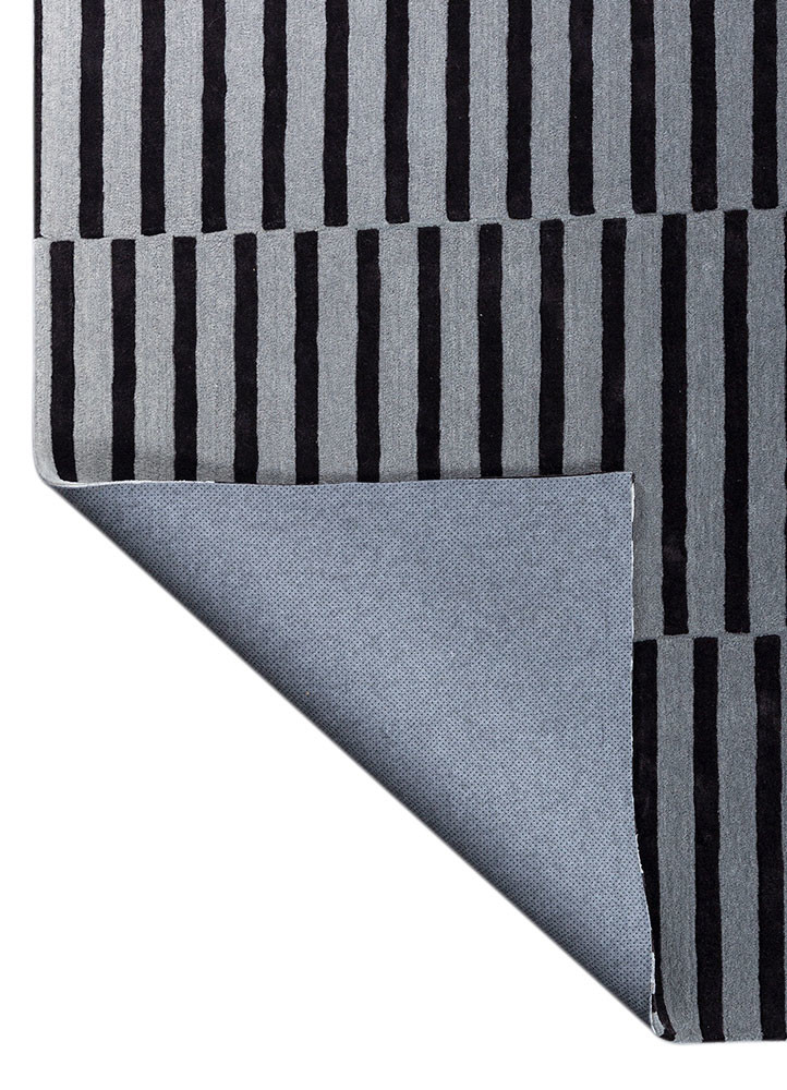 faces grey and black wool and viscose hand tufted Rug - Backing Shot